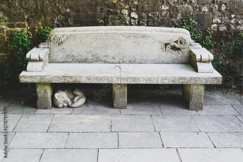beautiful old stone bench with label 