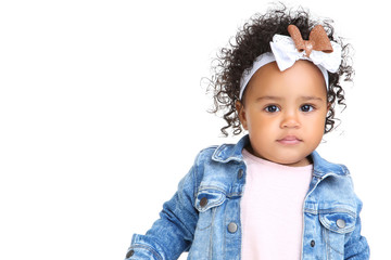 Beautiful baby girl in fashion clothing on white background