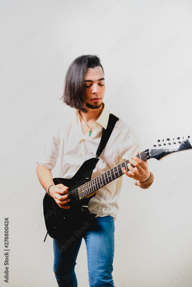 Electric guitar and guitarist playing, isolated on white background copy space. Electric guitar and guitarist playing, isolated on white background copy space.