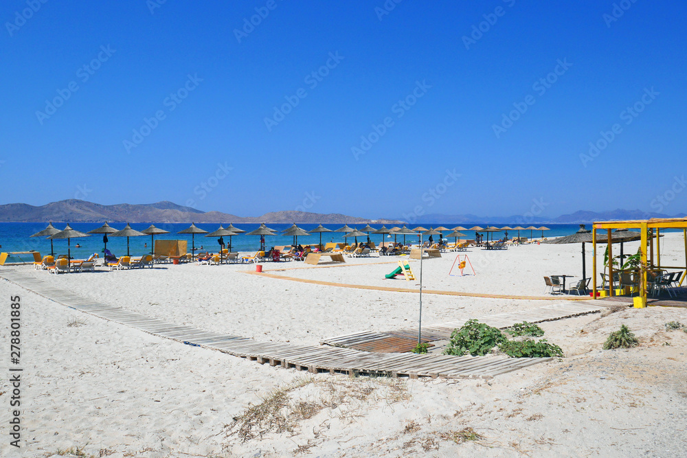 beach with umbrellas and chairs on beach
