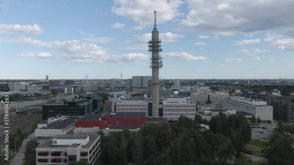 Flying next to tower with antenna and satellite. Telecommunication. Broadcasting station.