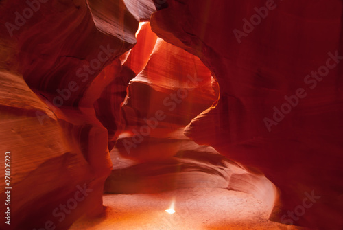 Bright shaft of light in Antelope Canyon, a famous tourist sight on Navajo Lands near Page, Arizona.
