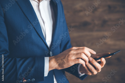 man hand holding smart phone