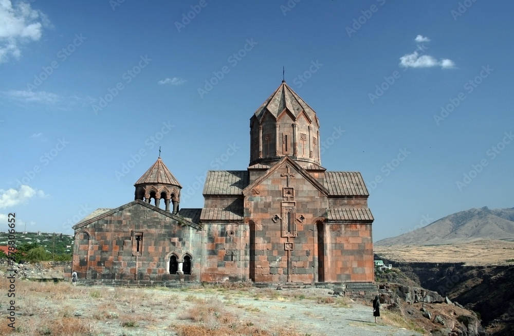 Exterior view to St. Hovhannes Karapet aka St. John the Baptist Cathedral at Hovhannavank Monastery in Ohanavan with tourists, Aragatsotn Province, Armenia