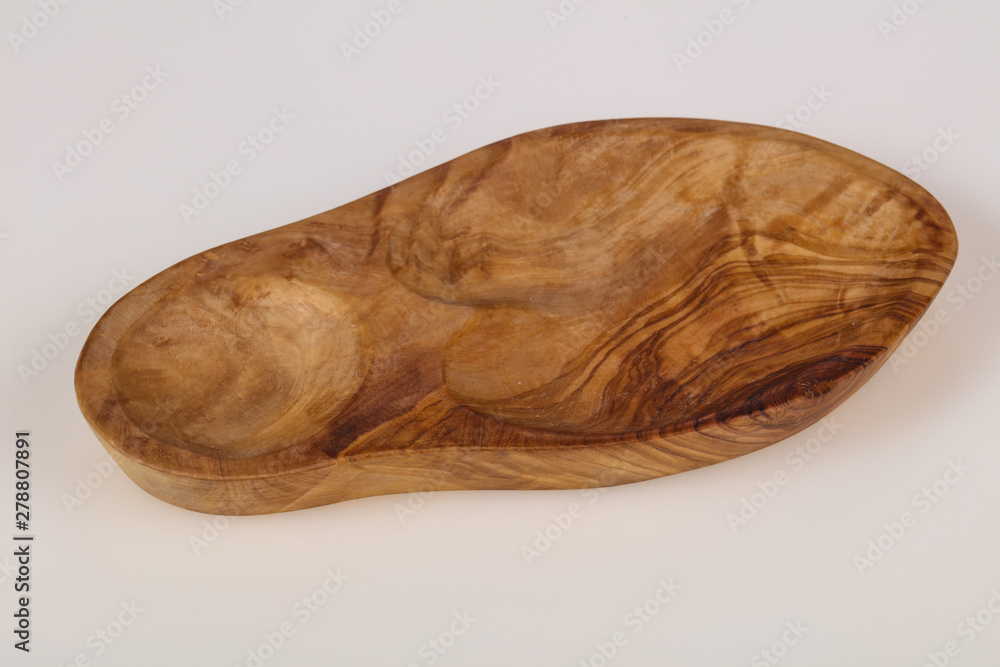 Empty wooden bowl made from olive wood Empty wooden bowl made from olive wood