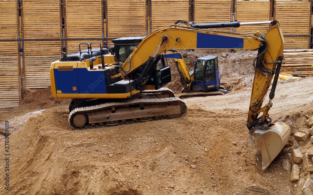 An excavator prepares a pit for construction.
