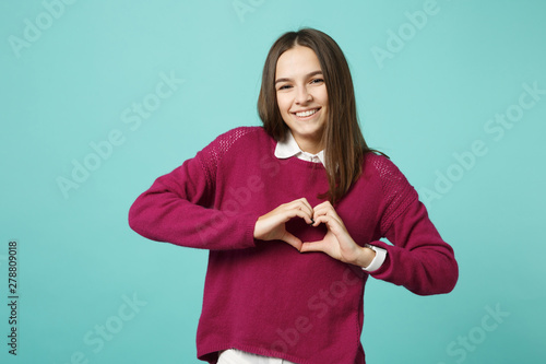 Fotografia Young brunette woman girl in casual clothes posing isolated on blue green turquoise wall background studio portrait