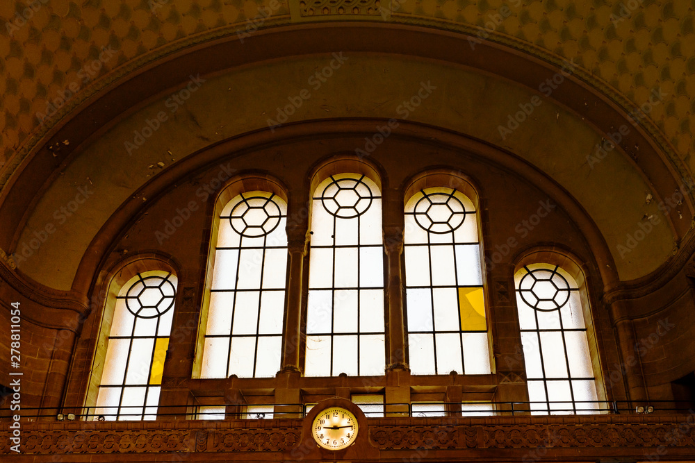 leaded windows and clock in train station Gare De Metz Ville. Metz. France