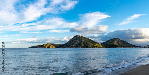 Sea bay in small town Tolo, located near Nafplio with clear water and fine sand, summer vacation destination for families with kids