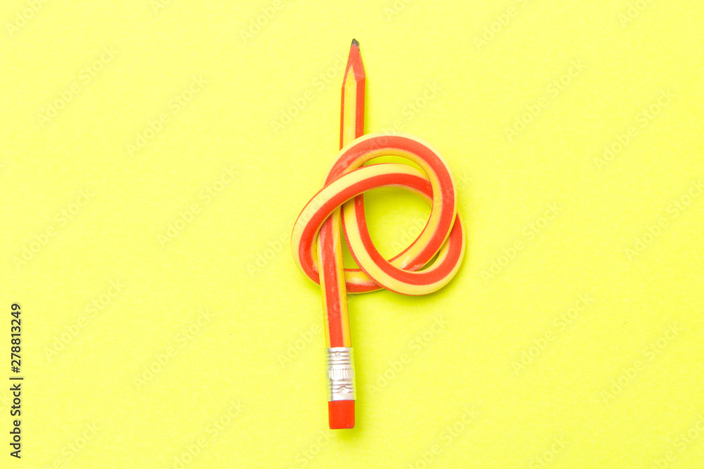Flexible pencil . The concept of Binding business. Bent pencils two-color on background . Flexible pencil . The concept of Binding business. Bent pencils two-color on background .