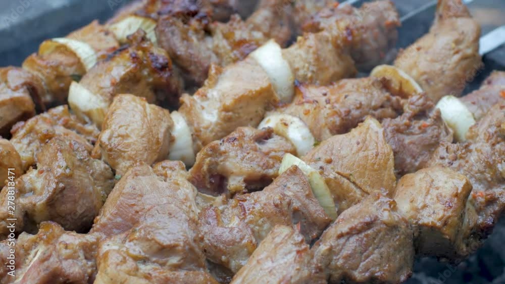 close up kebab barbecue on the outdoors grill . Pork meat prepared on fire. close up kebab barbecue on the outdoors grill . Pork meat prepared on fire.