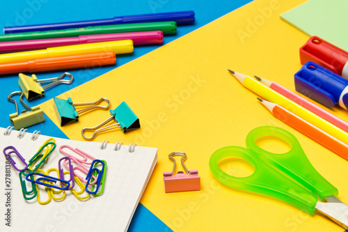 Stationery. School and office supplies on a colored background. Selective focus