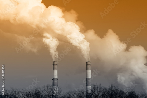 Stream of smoke from the chimney of factory. Toned image