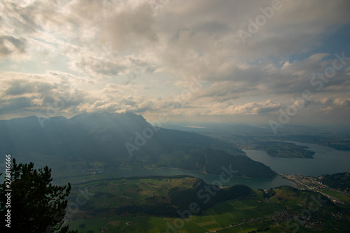 view from the Stanserhorn down on Lake Lucerne with clouds in the sky
