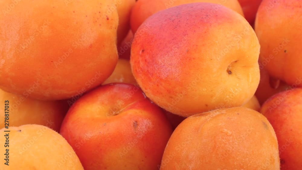 Juicy apricots rotating, (loopable), close up. Shot in 4K