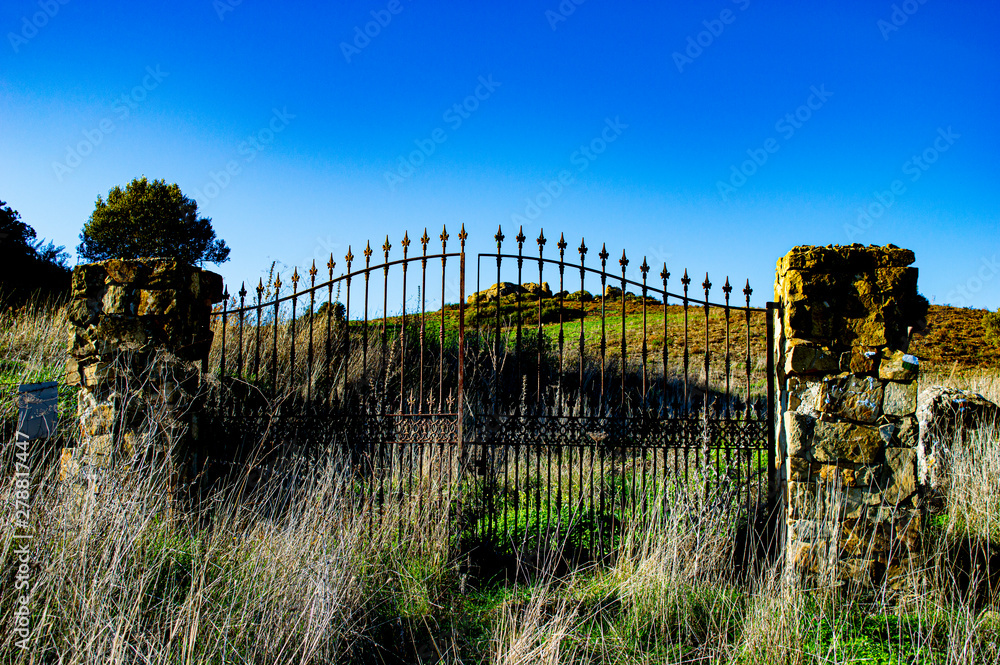 iron gate in the middle of the hill