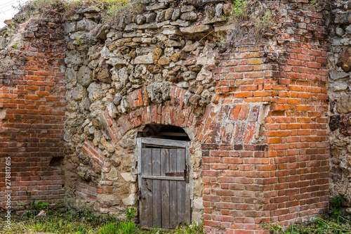 Fototapeta Naklejka Na Ścianę i Meble -  An old cellar of bricks and stones on the territory of the estate Gorodnya (Galician nobles) near Kaluga. Ferzikovsky District, Kaluzhskiy region, Russia - July 2019