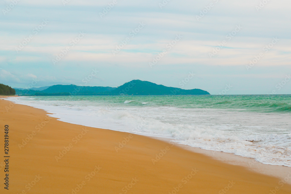 Beautiful beach ocean wave with blue color water of the sea background in daytime