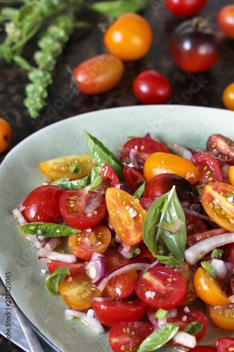 cherry tomato salad with basil and red onion, large sea salt and olive oil