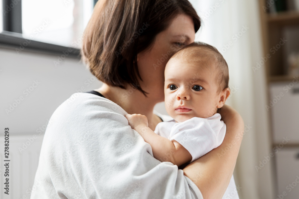 babyhood, motherhood and people concept - close up of mother holding her baby babyhood, motherhood and people concept - close up of mother holding her baby