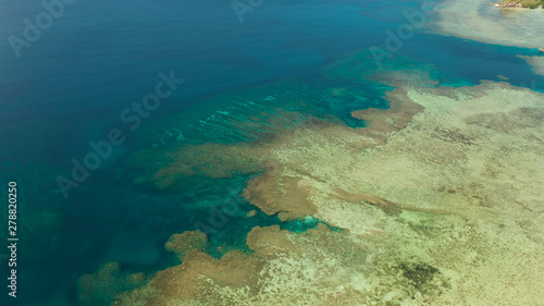 Aerial view lagoon with coral reef, atoll and turquoise water. Busuanga, Palawan, Philippines. Seascape island and clear blue water tropical landscape