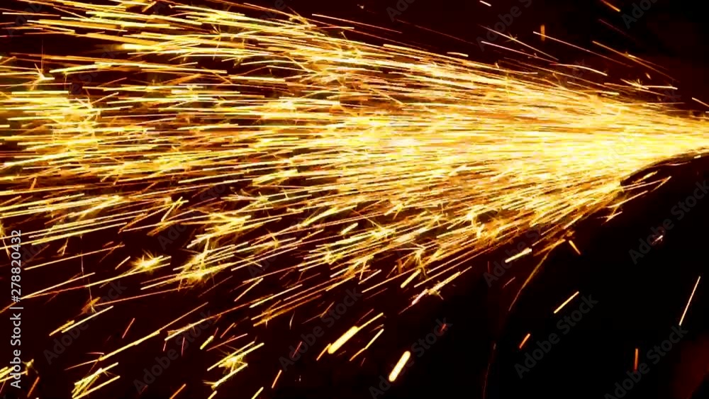 Sparks from the angle grinder fly in different directions Sparks from the angle grinder fly in different directions
