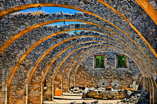 Beautiful arches in the old, abandoned olive press at Agios Georgios (Saint George) monastery, Karydi, Apokoronas, Chania, Crete, Greece. photo