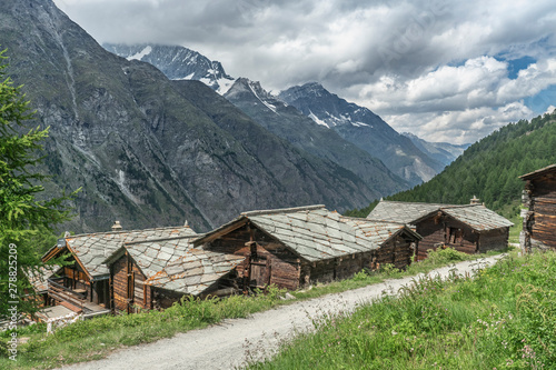 traditional wooden houses in the village of Tufteren, high above Zermatt, the famous touristic destination in the canton Valais, Wallis, Switzerland photo