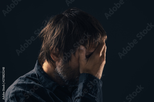 Depressed sad mid-adult man portrait © Bits and Splits