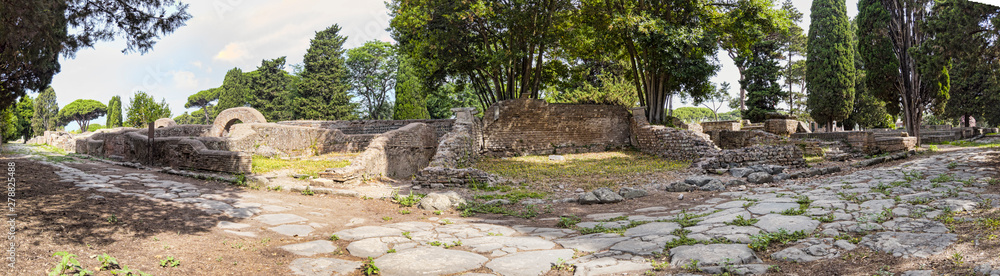 Immersive panoramic 180 degree view from cobblestone pathway of  ancient Roman necropolis landmark  in the archaeological excavations of Ostia Antica - Rome