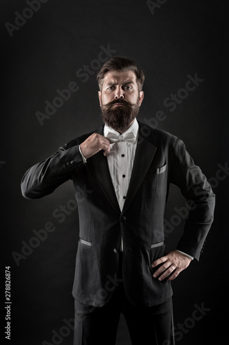 Hipster formal suit tuxedo. Difference between vintage and classic. Official event dress code. Classic style. Menswear classic outfit. Bearded man with bow tie. Well dressed and scrupulously neat