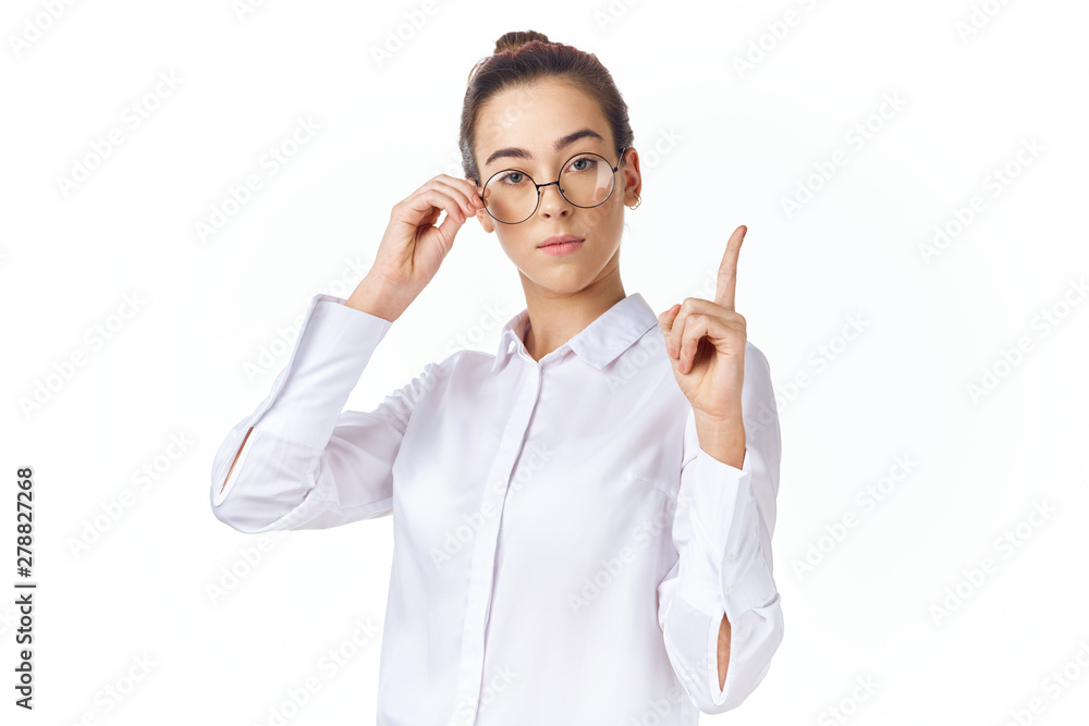 portrait of a young woman pointing at copyspace portrait of a young woman pointing at copyspace