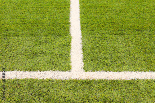 New artificial football field. Close-up. Background. Texture.
