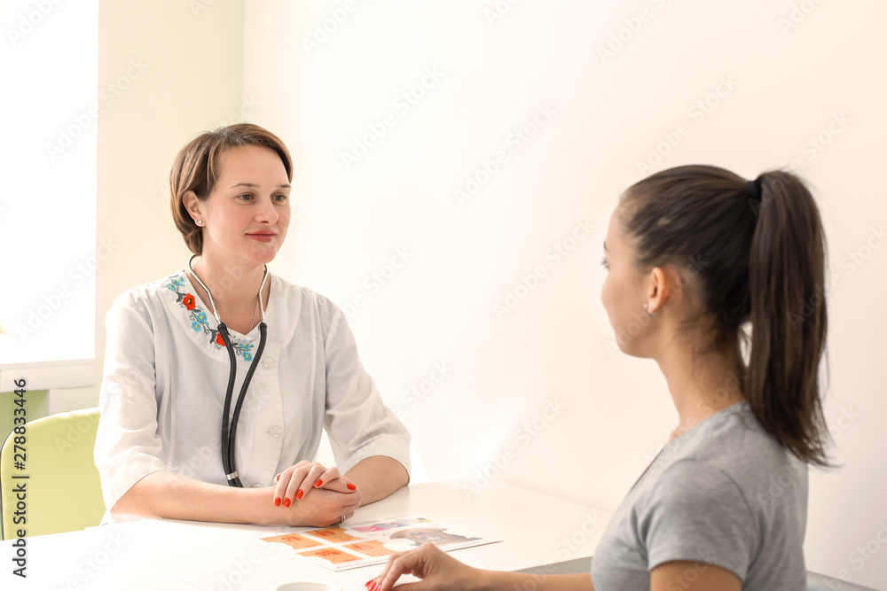Young girl patient examined by a general practitioner Young girl patient examined by a general practitioner