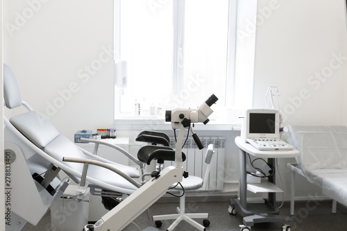gynecological chair in a light gynecologist s office