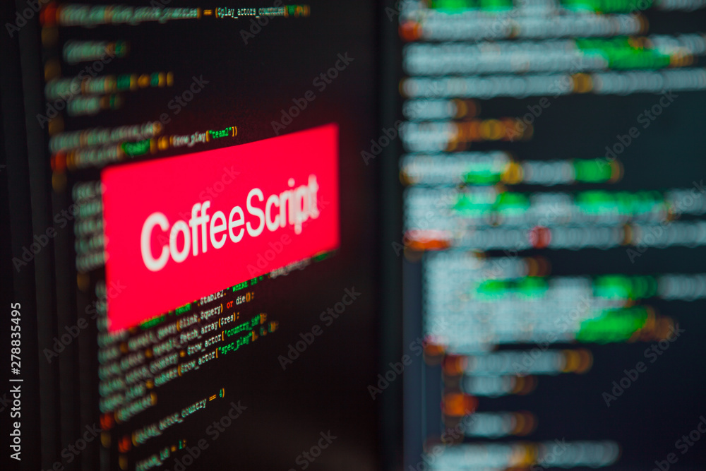 Programming language, CoffeeScript inscription on the background of computer code. Programming language, CoffeeScript inscription on the background of computer code.