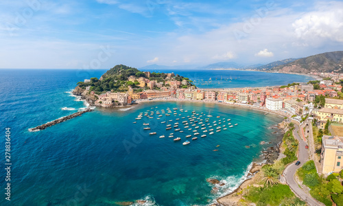 Sea aerial landscape in Sestri Levante, Liguria, Italy. Scenic fishing village with traditional houses and clear blue water. Summer vacation rich resort with picturesque harbour and nice sand beach photo