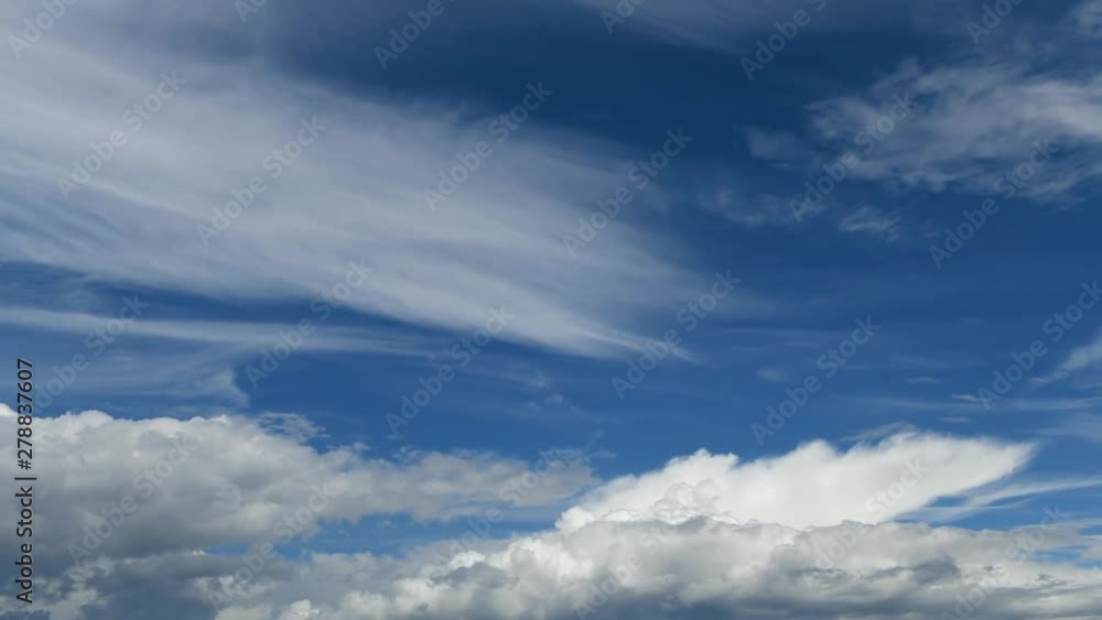 Beautiful timelapse of deep blue sky and flying clouds during sunny day Beautiful timelapse of deep blue sky and flying clouds during sunny day
