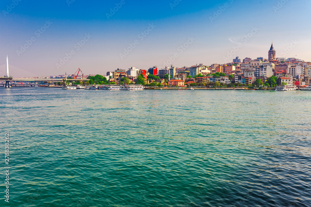 Naklejka premium Panoramic view of Istanbul. Panorama cityscape of famous tourist destination Golden Horn bay part of Bosphorus strait. Travel landscape Bosporus, Turkey, Europe and Asia.