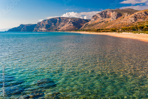 Panoramic sea beach landscape near Gaeta, Lazio, Italy. Nice sand beach and clear blue water. Famous tourist destination in Riviera de Ulisse. Bright sunny light and sunset.