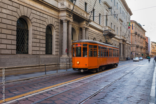 Old vintage tram in the city centre of the Milan, Lombardia, Italy. Famous tourist destination in South Europe