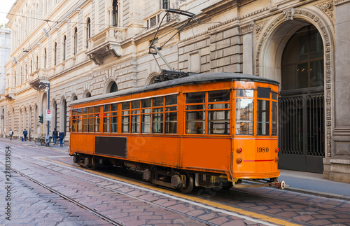 Old vintage tram in the city centre of the Milan, Lombardia, Italy. Famous tourist destination in South Europe