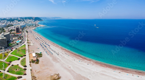 Aerial birds eye view drone photo of Elli beach on Rhodes city island, Dodecanese, Greece. Panorama with nice sand, lagoon and clear blue water. Famous tourist destination in South Europe © oleg_p_100