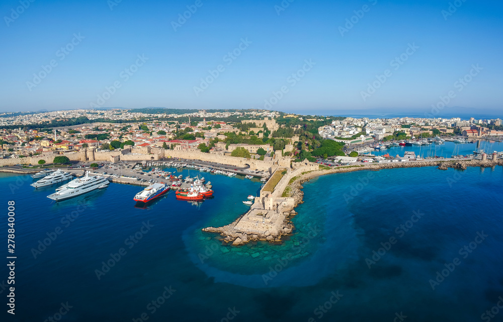 Aerial birds eye view drone photo of Rhodes city island, Dodecanese, Greece. Panorama with Mandraki port, lagoon and clear blue water. Famous tourist destination in South Europe