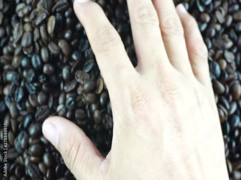 Close up hands touch coffee beans, Top view Food concept. Close up hands touch coffee beans, Top view Food concept.