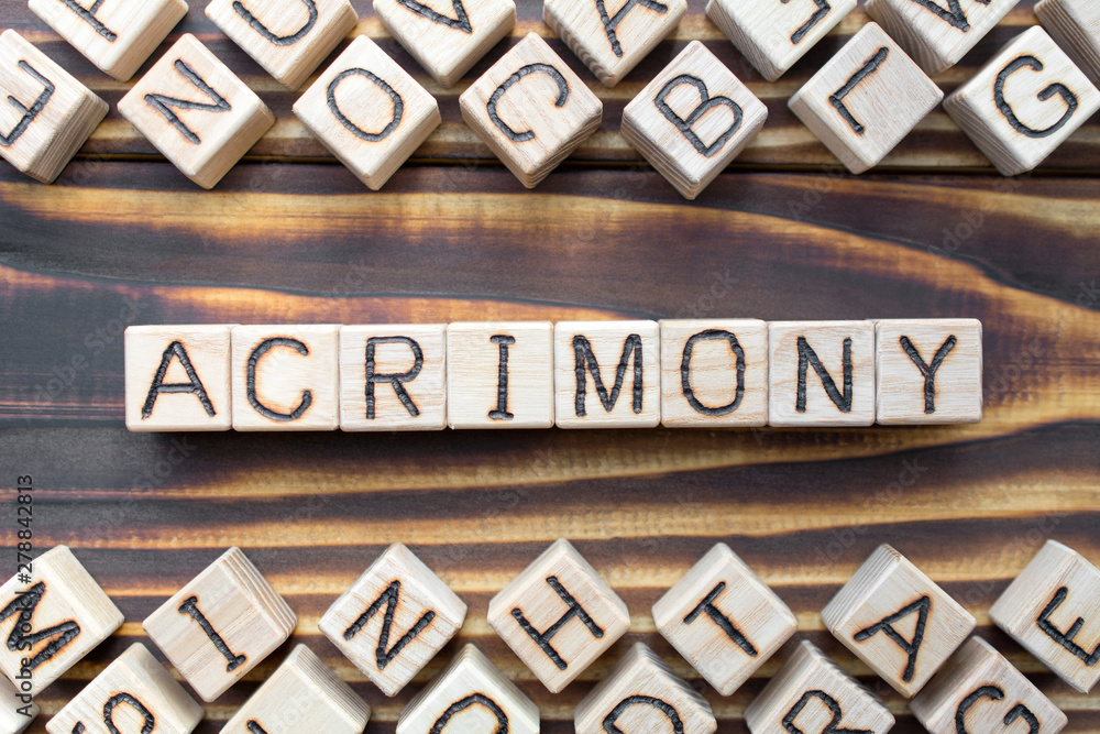acrimony wooden cubes with letters, bitter full of anger concept, around the cubes random letters, top view on wooden background acrimony wooden cubes with letters, bitter full of anger concept, around the cubes random letters, top view on wooden background