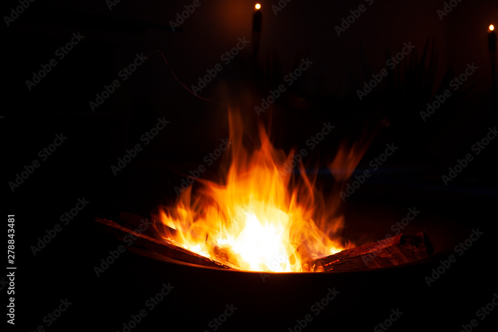Fire lit by the hand of the man who placed dry tree trunks and branches to make fire photography taken with the help of a tripod at low speed with natural light Cocoyoc Mexico Morelos Fire lit by the hand of the man who placed dry tree trunks and branches to make fire photography taken with the help of a tripod at low speed with natural light Cocoyoc Mexico Morelos