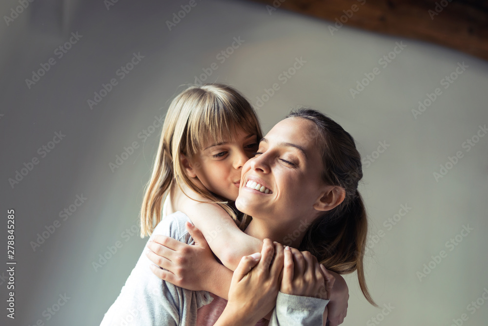 Mother and daughter playing at home, piggyback Mother and daughter playing at home, piggyback