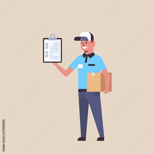 postman in uniform holding cardboard parcel box and receiving form clipboard smiling courier express delivery service concept flat full length