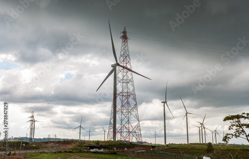 Panorama view of Clean energy generator electric system of Wind turbines with Electric Tower on top mountain with sunny and cloud in morning time at Khao kho, Phetchabun province, Thailand